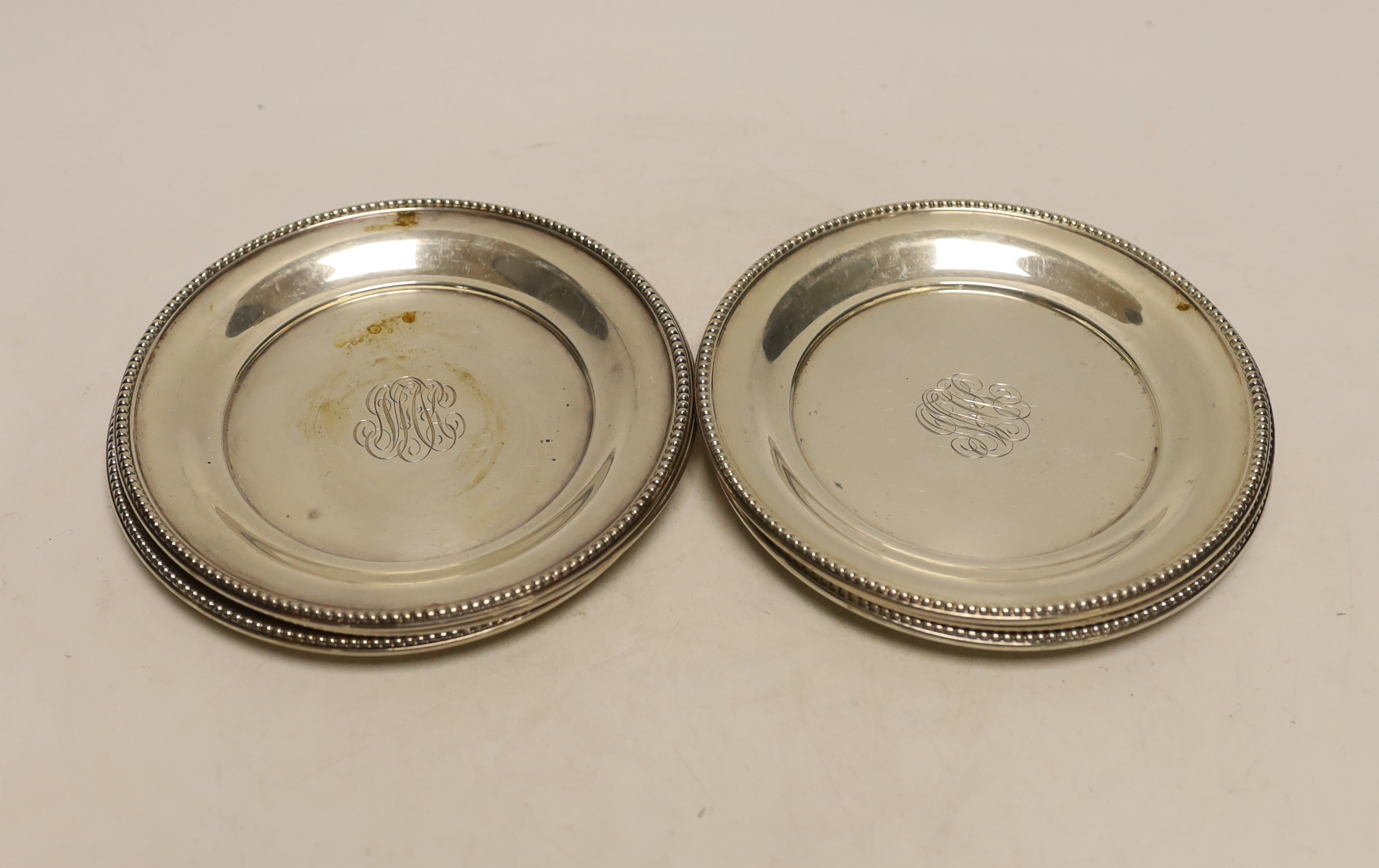 A set of six American sterling dishes, by R. Wallace & Sons, with engraved monogram and beaded borders, 15.1cm, 18.8oz.